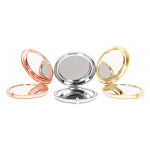 Espejo metálico doble BARDOT con aumento fabricado en acero inoxidable, diseño compacto, circular y elegante.